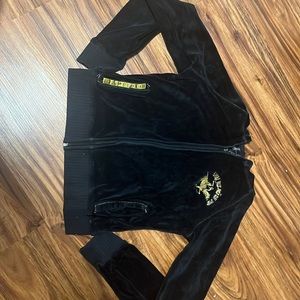 This is a black polo sweater